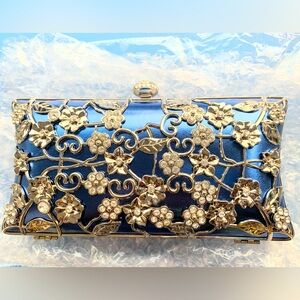 Blue clutch with silver floral vine embellishments